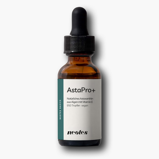 neotes astaxanthin oil in an amber glass bottle with dropper on a light background