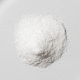White neotes betaine TMG powder in close-up on a light background