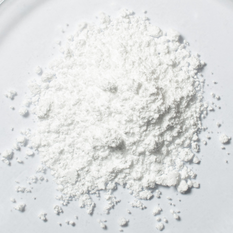 White FocusMind Pro© powder with creatine, niacin and selenium in close-up on a light background