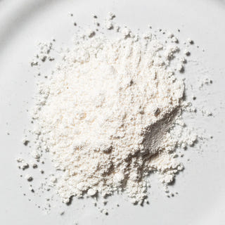 White NMN powder in close-up on a light background