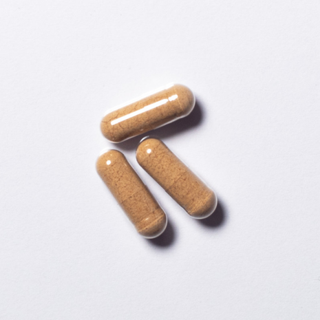 Brown vegan RestPeak® capsules with ashwagandha and melatonin in close-up
